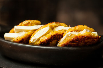 Traditional Colombian Arepa de Choclo Preparation : Arepas de choclo filled with white cheese