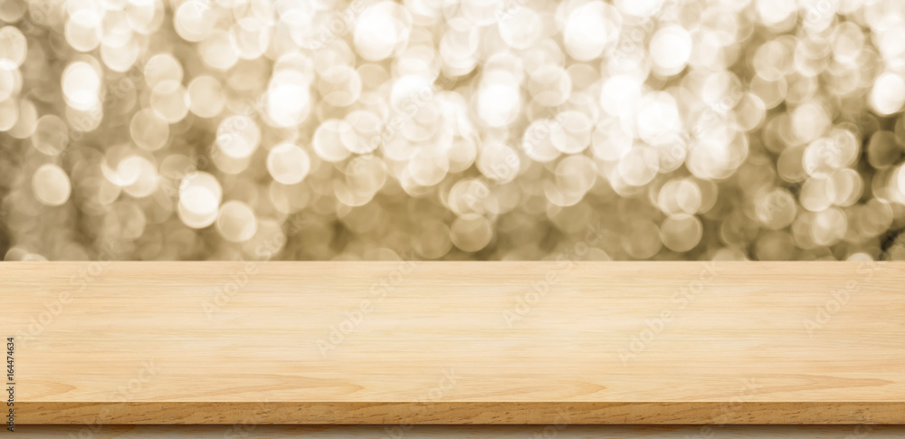 Poster empty wood table top with blur sparkling gold bokeh abstract background,panoramic banner for display