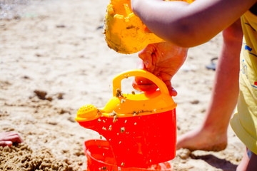 childs are playing game at the beach, close up