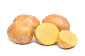 Vegetables potatoes in a cut and whole form on a white background