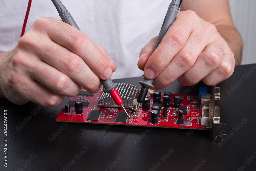 Poster electronic circuit red board inspecting close up