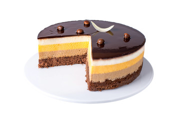 Isolated orange chocolate cake with layers of delicate souffle, a Delicious homemade dessert.