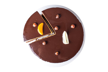 Isolated orange chocolate cake with layers of delicate souffle, a Delicious homemade dessert.