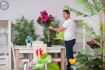 Young man in gardening concept at home