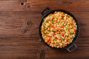 Fried rice with chicken. Prepared and served in a wok.