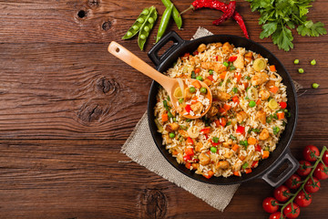 Fried rice with chicken. Prepared and served in a wok.