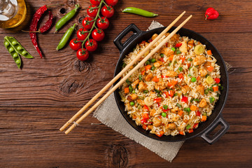Fried rice with chicken. Prepared and served in a wok.