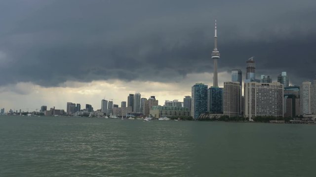 Establishing shot of the Toronto skyline as seen from the ferry approaching the city.