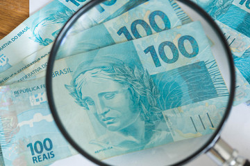 Brazilian currency, high nominal under the magnifier