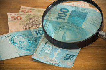 Brazilian currency, high nominal under the magnifier