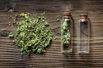 Alternative medicine. Store up medicinal herbs. Dried herbs on wooden table background