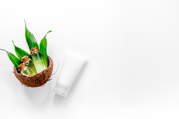 Body treatment. Coconut cream on white background top view copyspace