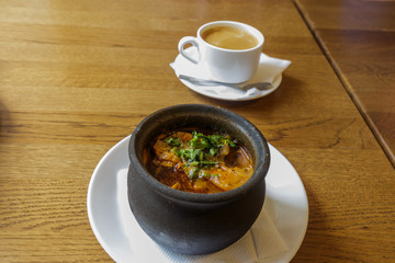 Traditional Georgian soup Kharcho with meat and rice on wooden background