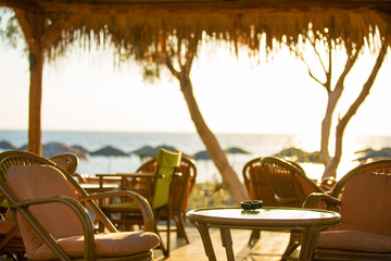 Outdoor cafes in coastline resort Kamari in Santorini Greece