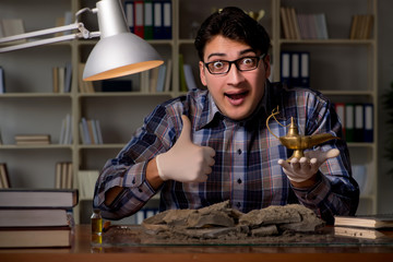 Archeologist working late night in office