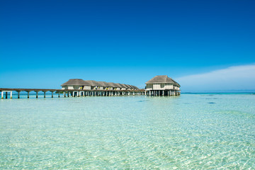 Wooden villas over water of the Indian Ocean, Maldives