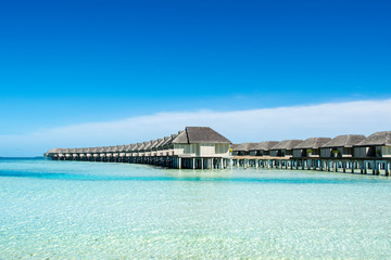 Wooden villas over water of the Indian Ocean, Maldives