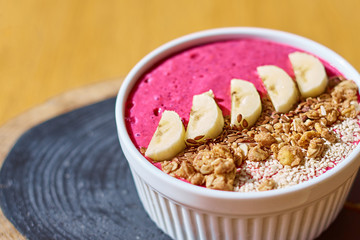 food background of fresh berry blended dessert of bananas blueberry and muesli