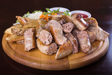 Assorted sausages with sauce