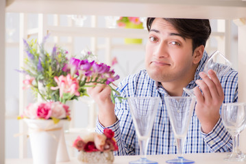 Young handsome man shopping in shop
