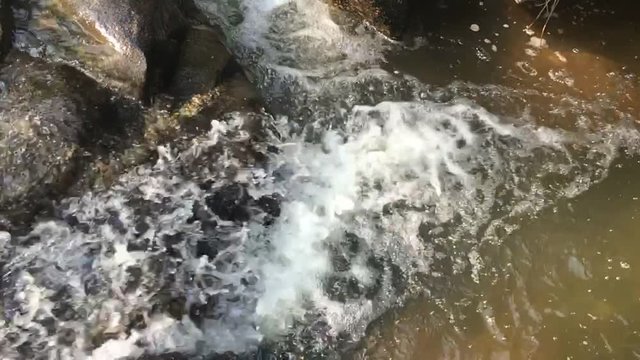 Slow motion of waterfall, The waterfall on the mountain and forest, Waterfall and water spread and rock