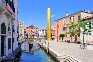 VENICE, ITALY - MAY, 2017: James Lee byars 20-meter-tall "golden tower" erected along venice's grand canal. Venice art biennale.