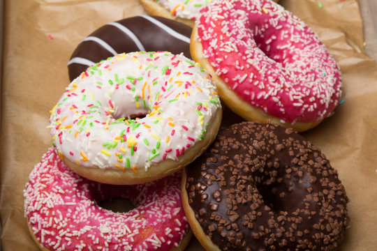 Colorful donuts with chocolate and icing, selective focus