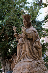 Fototapeta na wymiar MALAGA, ANDALUCIA/SPAIN - JULY 5 : Statue of Queen and Baby in the Gardens of the Cathedral in Malaga Costa del Sol Spain on July 5, 2017