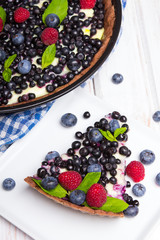 Delicious tart with blueberries and raspberries