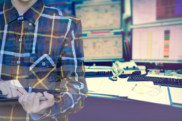 Double exposure of  women Engineer in hipster shirt  working with tablet in control room of oil and gas platform or plant industrial for monitor process, business and industry concept
