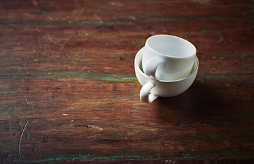 Fototapeta na wymiar Two White Coffee Cups on a rustic Table