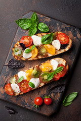 Bruschetta with tomatoes, mozzarella and basil