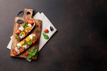 Bruschetta with tomatoes, mozzarella and basil