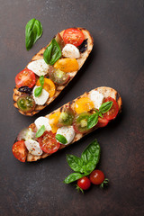 Bruschetta with tomatoes, mozzarella and basil
