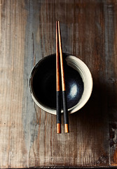 Wooden Chopsticks on a Ceramic Bowl