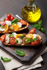 Bruschetta with tomatoes, mozzarella and basil