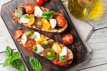 Bruschetta with tomatoes, mozzarella and basil