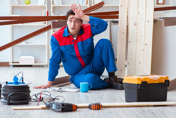 Young carpenter at work tired feeling not well