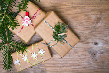 Christmas presents on wooden background, retro style with copy space