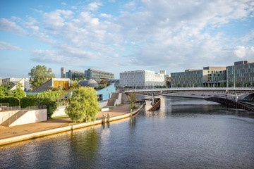 Morning cityscape view on the modern financial district with Spree river near the parliament building in Berlin city