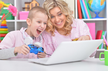Mother and son playing game