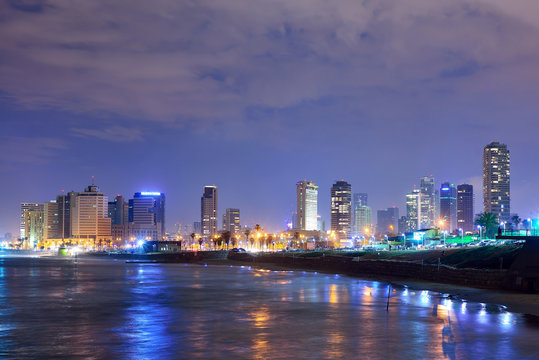 TEL AVIV, ISRAEL - APRIL, 2017: View of the night Tel Aviv and the Mediterranean Sea at Night. The famous tourist view of modern Tel Aviv.