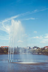 Fountain on a lake. Magazine cover concept