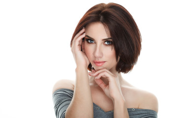 Beauty portrait of adult adorable fresh looking brunette woman with gorgeous makeup bob hairdo posing against isolated white background showing emotion and facial expression concept.