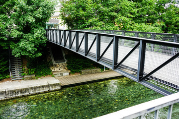 iron bridge over small city river