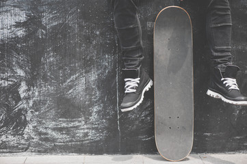 Legs in sneakers at the skateboard © Natalia