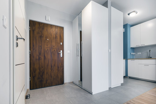 Entrance to small apartment in modern apartment