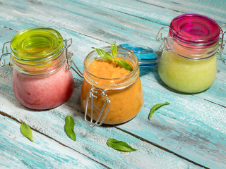 Homemade sorbet of watermelon, apricot and melon on wooden board