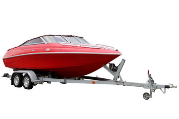Red Motor boat on a trailer for transportation.