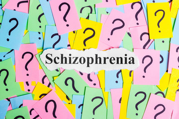 Schizophrenia Syndrome text on colorful sticky notes Against the background of question marks